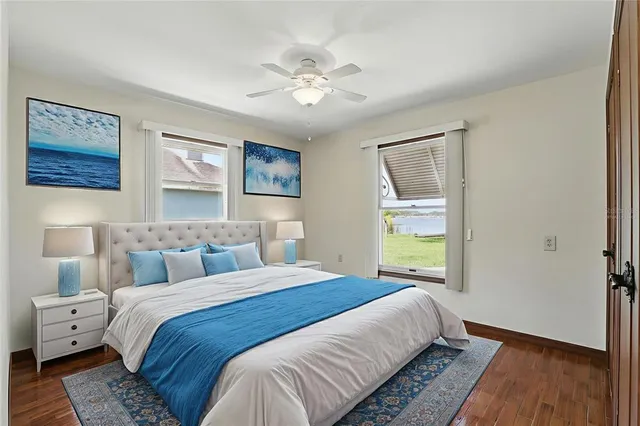 a bedroom with a large bed and a window