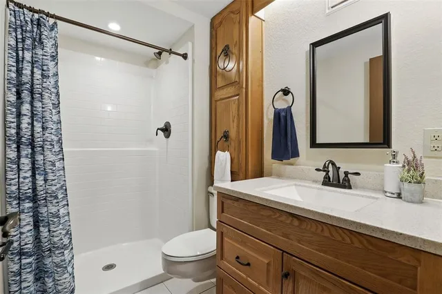a view of a room with wooden floor and iron stairs