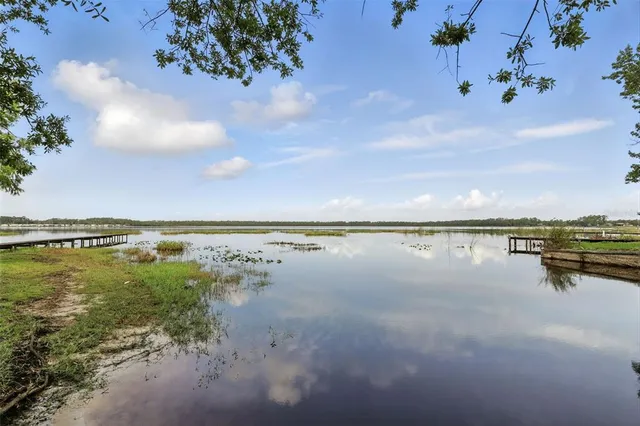 a view of a lake with a yard