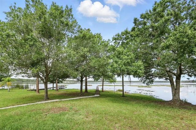 a view of a lake with a yard