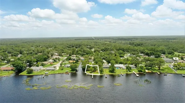 a view of a lake with trees by side of it