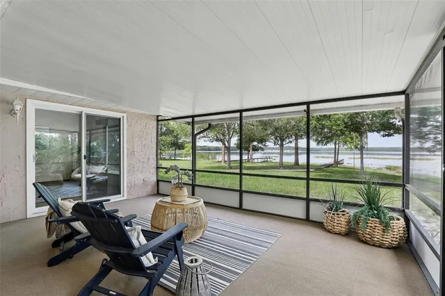 a view of a lake with houses in back