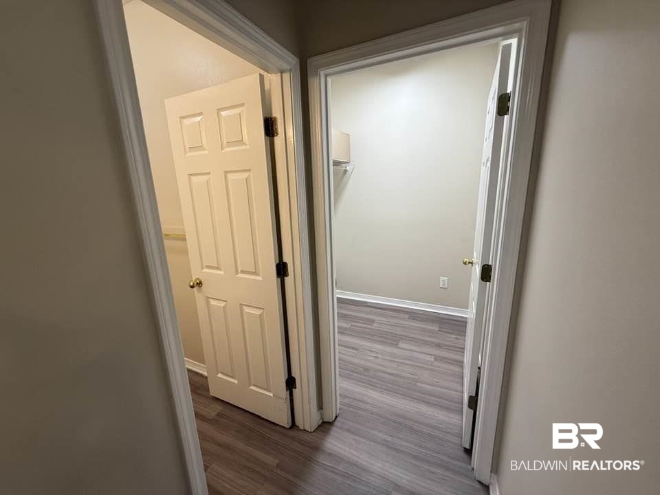 2651 South Juniper Street, Unit 401 Foley, AL 36535 - Photo 10 of 27 Hall with baseboards and wood finished floors