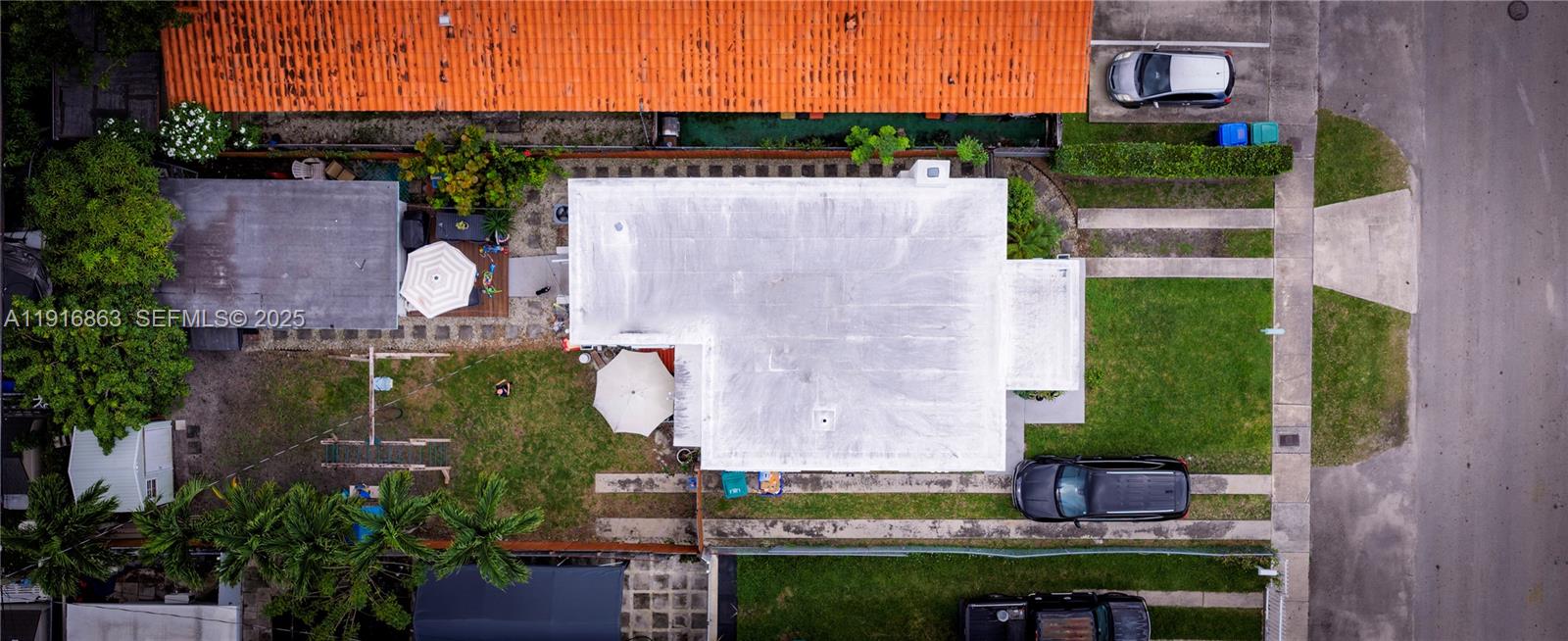 3422 Southwest 25th Street Miami, FL 33133 - Photo 11 of 17 an aerial view of a house with a garden and a yard