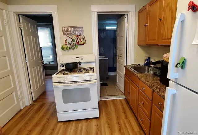 a kitchen with a stove and a refrigerator