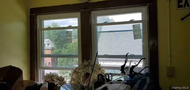 a view of a balcony dining area with furniture