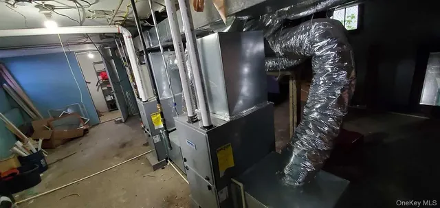 a view of walk in closet with clothes