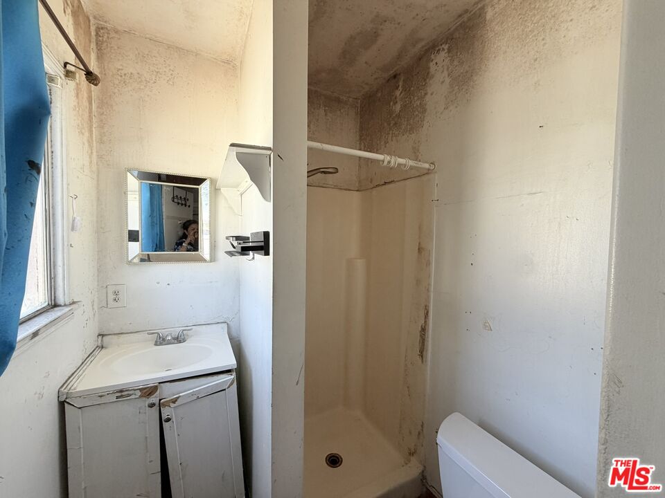 12918 Shreve Road Whittier, CA 90602 - Photo 41 of 42 a bathroom with a sink a toilet and shower