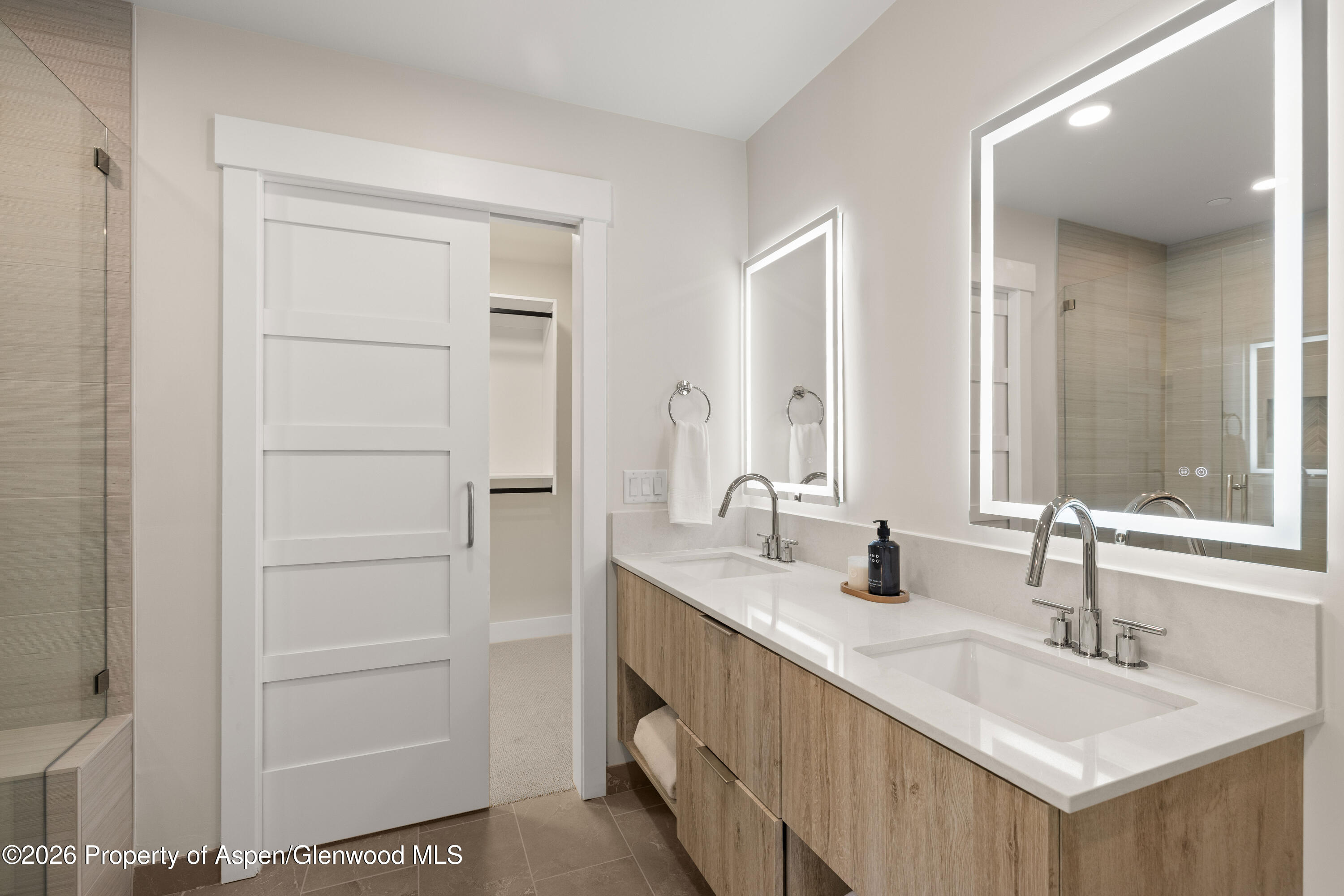 85 Kodiak Drive, Unit 320 Basalt, CO 81621 - Photo 13 of 20 a bathroom with a double vanity sink and a mirror