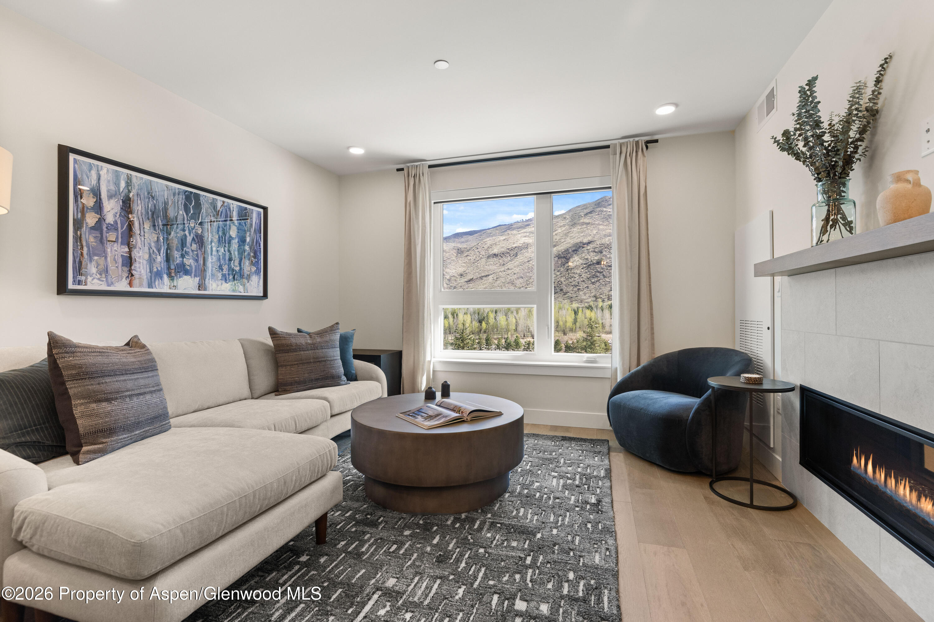 85 Kodiak Drive, Unit 320 Basalt, CO 81621 - Photo 2 of 20 a living room with furniture and a large window