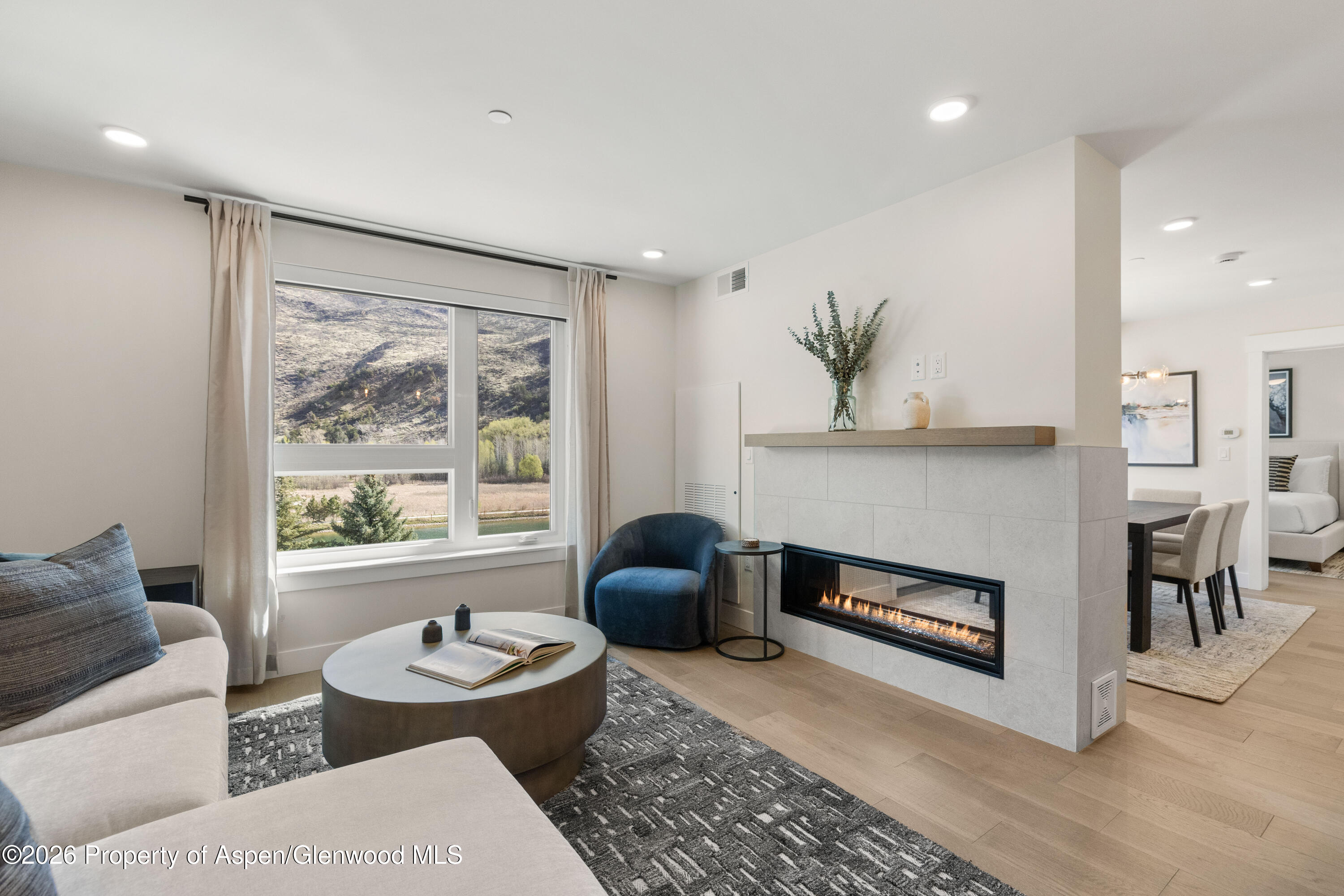 85 Kodiak Drive, Unit 320 Basalt, CO 81621 - Photo 4 of 20 a living room with furniture and a fireplace