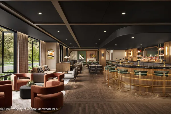 a living room with lots of furniture and chandelier