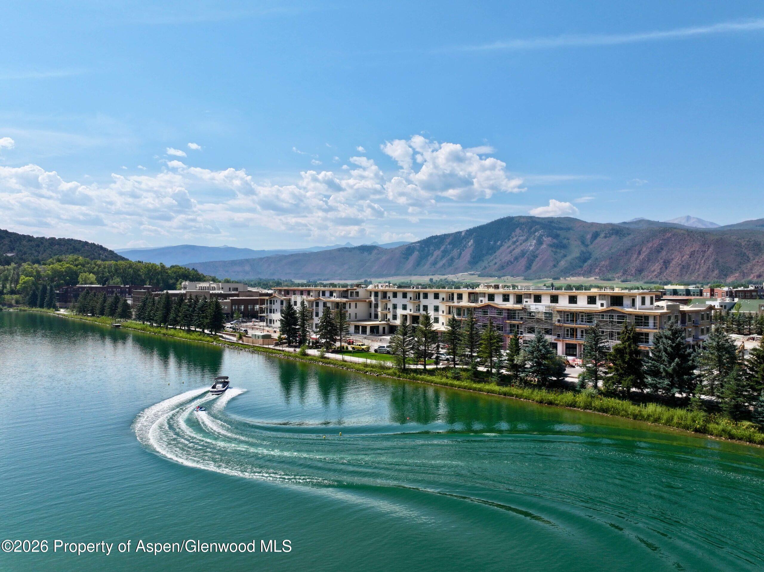 85 Kodiak Drive, Unit 320 Basalt, CO 81621 - Photo 8 of 10 a view of a lake with a mountain in the background
