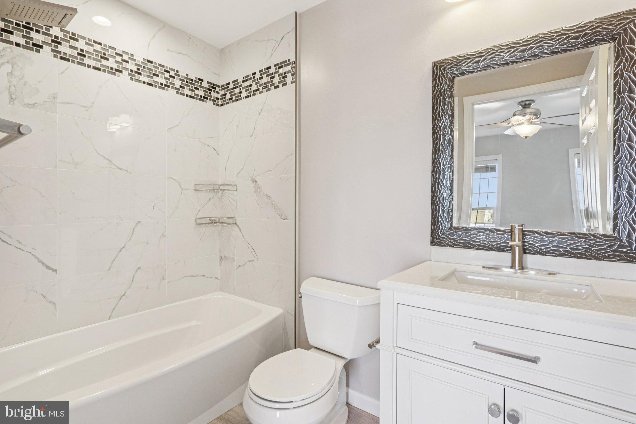 2675 Edgemont Street Philadelphia, PA 19125 - Photo 11 of 18 a bathroom with a sink a toilet and a bathtub