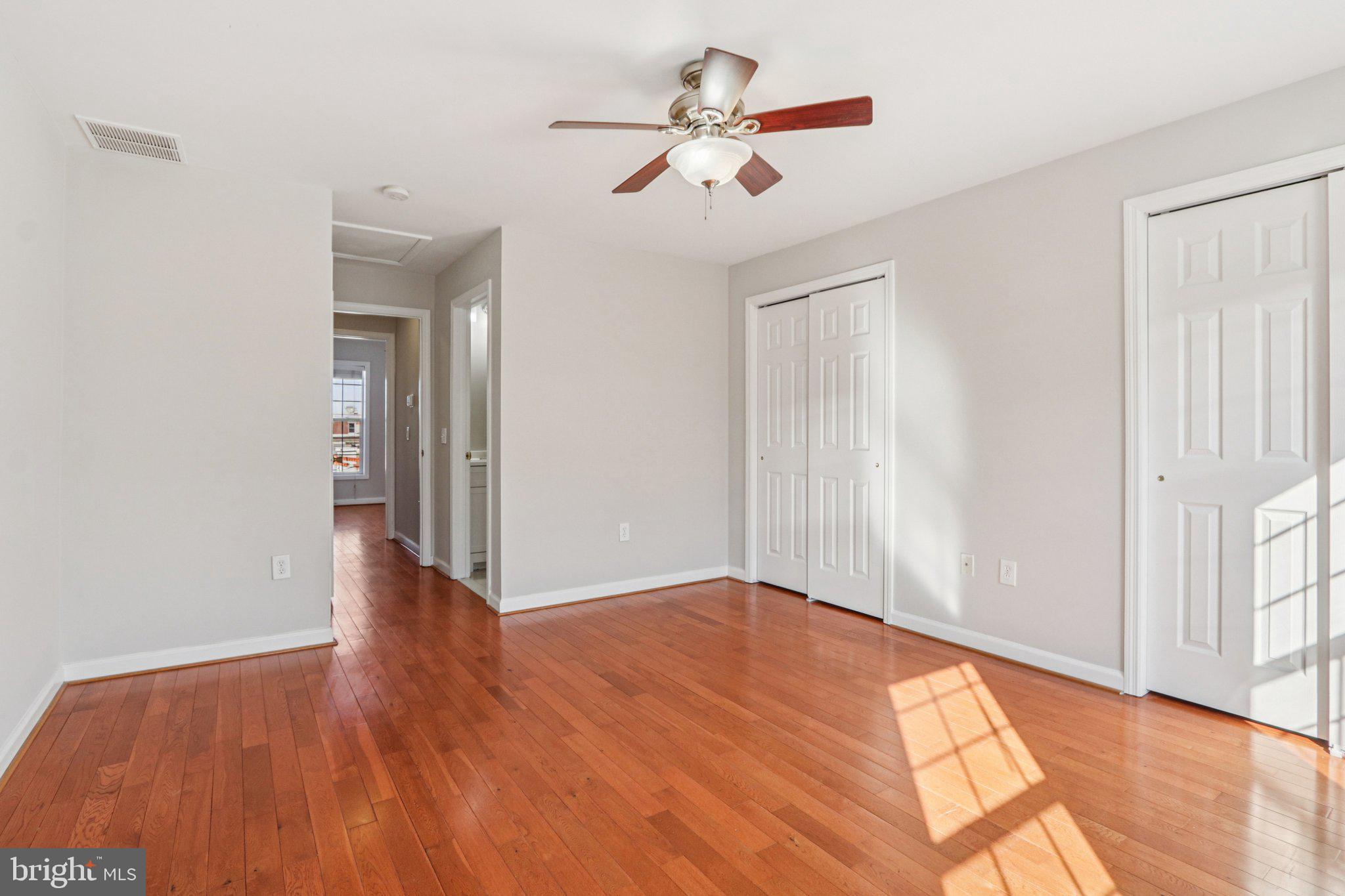 2675 Edgemont Street Philadelphia, PA 19125 - Photo 13 of 18 wooden floor in an empty room with a window