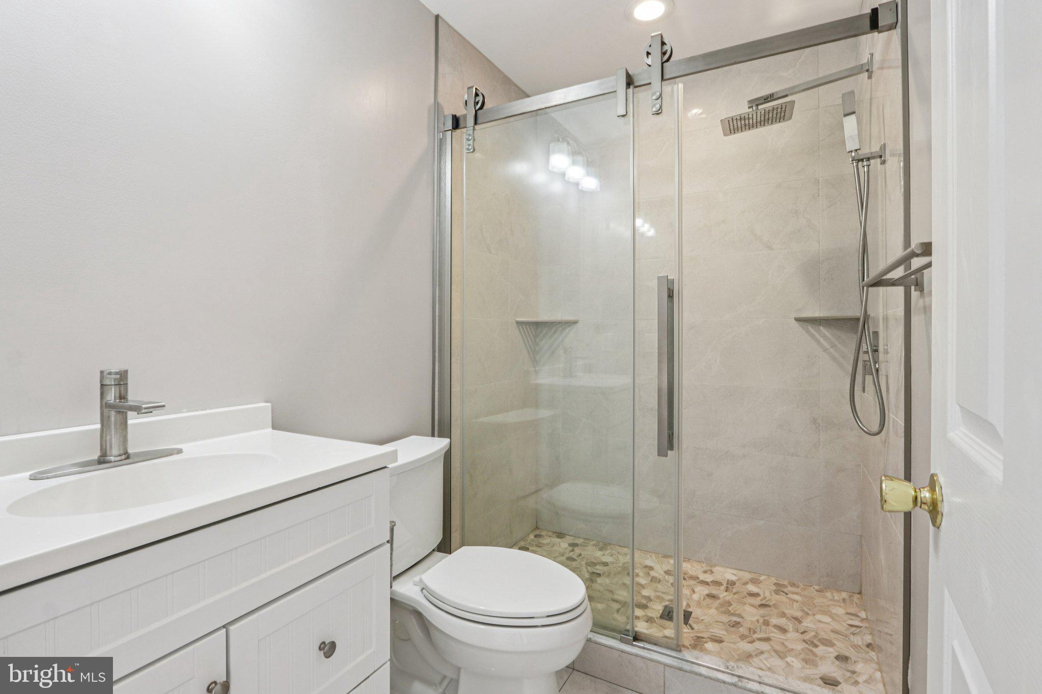 2675 Edgemont Street Philadelphia, PA 19125 - Photo 14 of 18 a bathroom with a sink toilet and shower