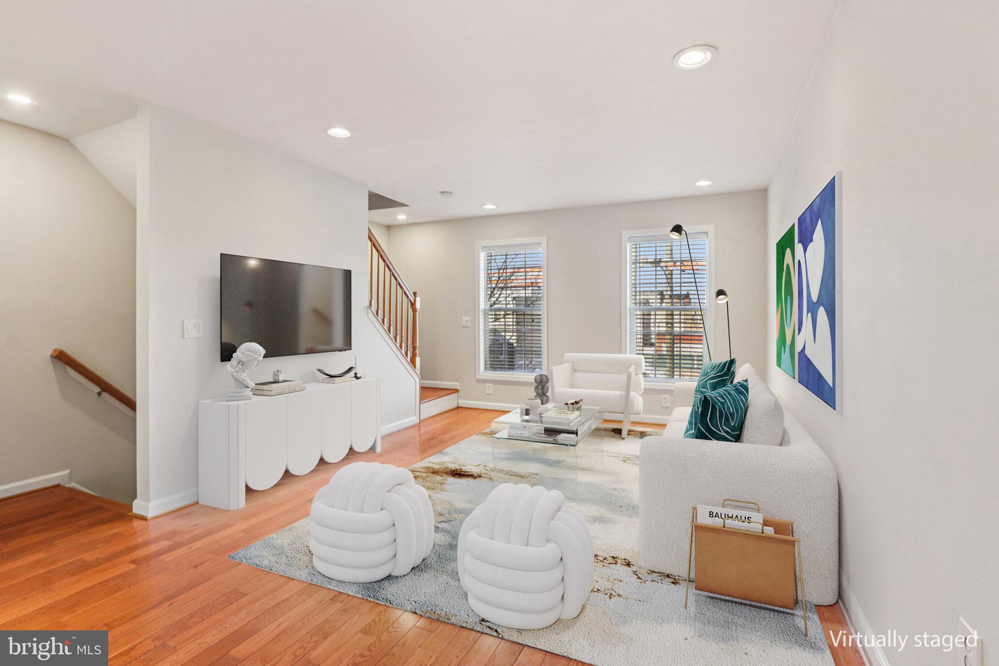 2675 Edgemont Street Philadelphia, PA 19125 - Photo 2 of 18 a bedroom with a bed and flat screen tv