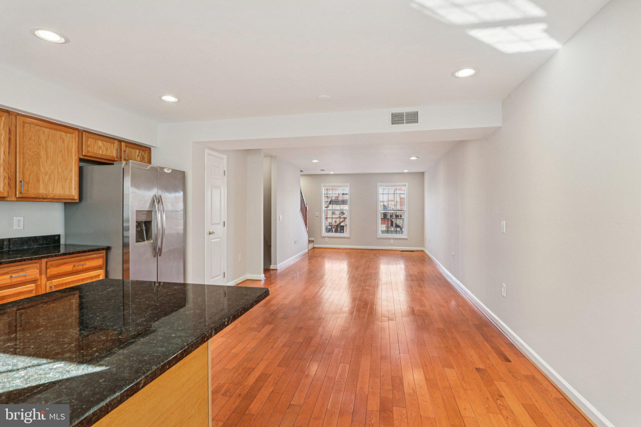 2675 Edgemont Street Philadelphia, PA 19125 - Photo 7 of 18 a view of a kitchen with wooden floor and a sink