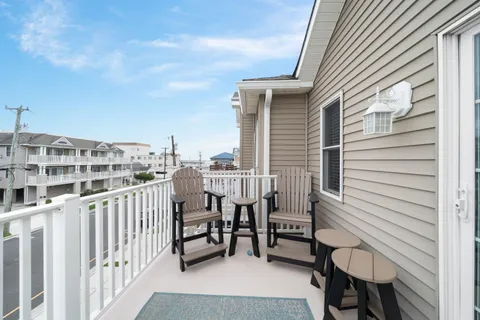 a view of a balcony with chairs