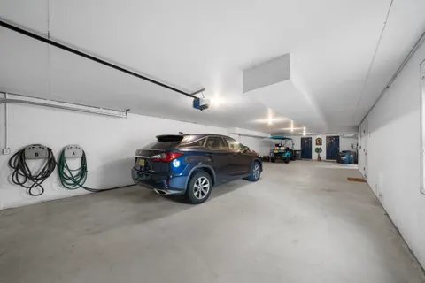 a view of a garage with parked cars