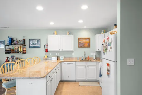 a kitchen with a sink and refrigerator