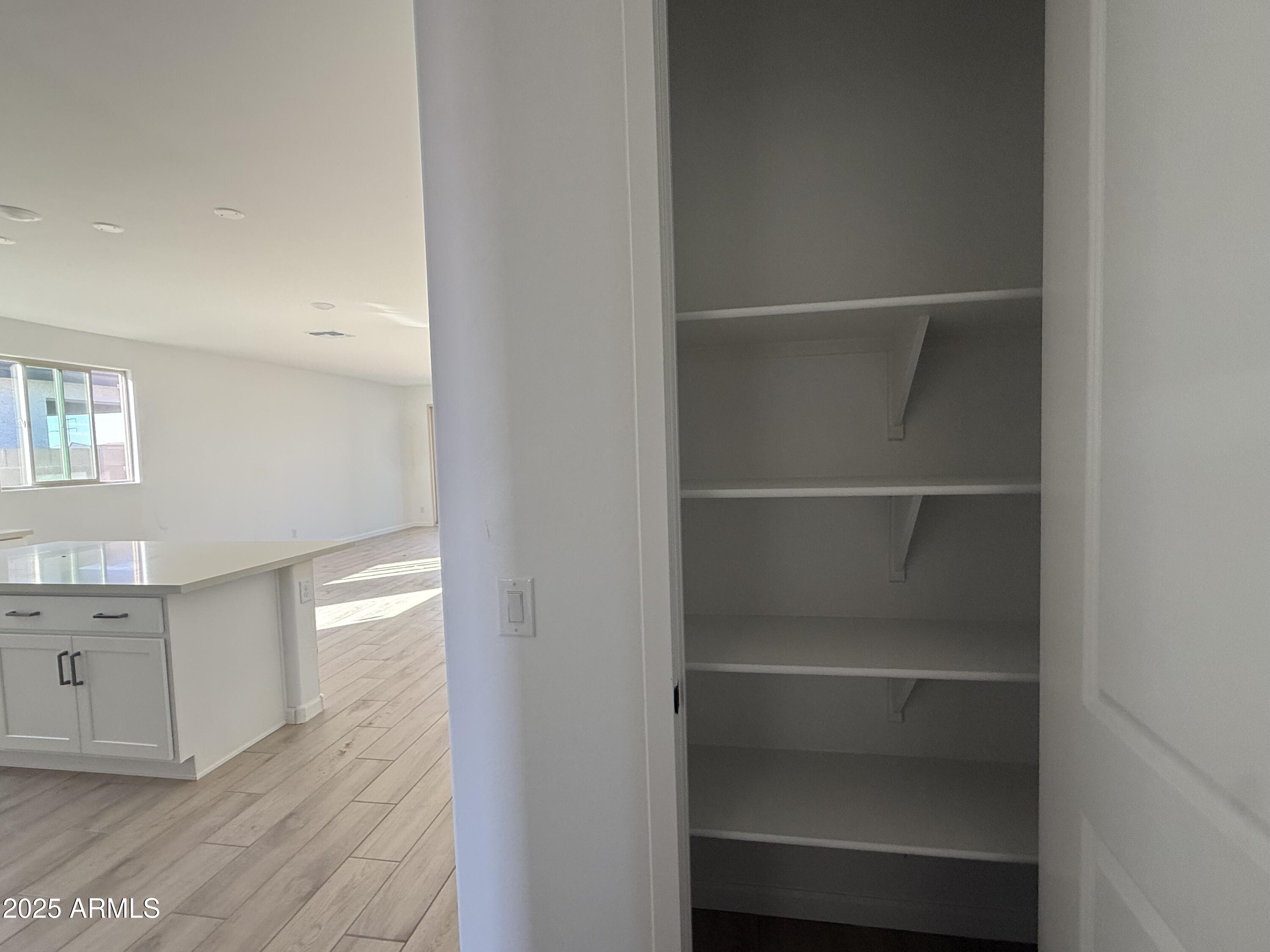 9620 West Tamarisk Avenue Tolleson, AZ 85353 - Photo 13 of 32 a view of a room with rack on the wall