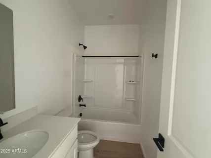 a bathroom with a bathtub and a toilet