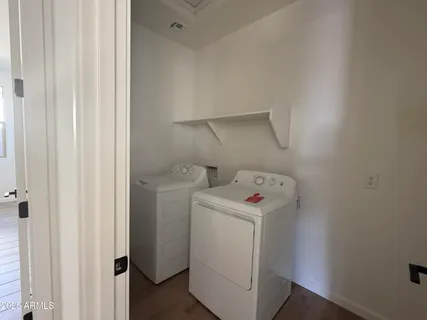 a view of storage and utility room with a washer and dryer