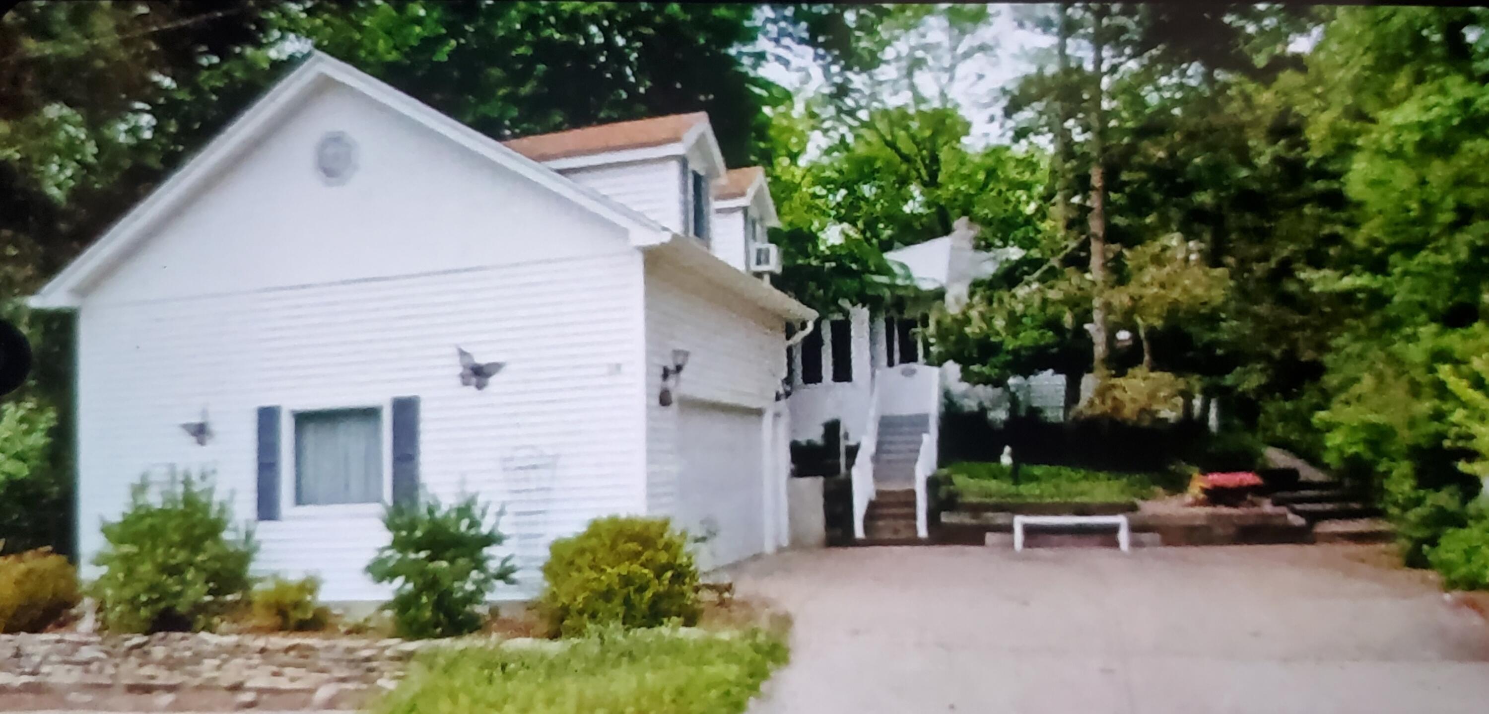 18 Diana Road Ogden Dunes, IN 46368 - Photo 12 of 13 a view of a house with a yard and sitting area
