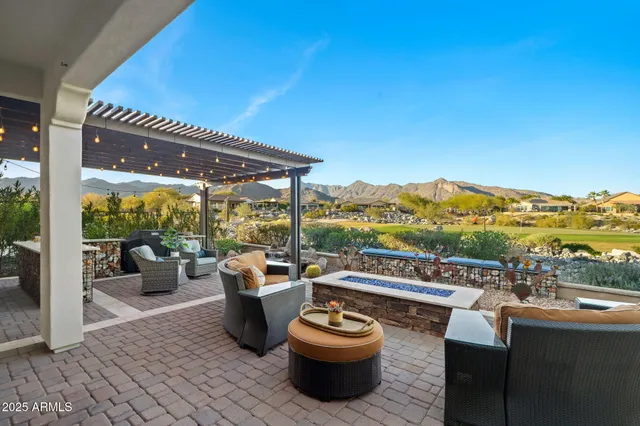 a view of a patio with couches chairs and a potted plant