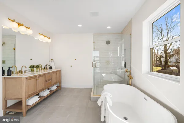 a bathroom with a bathtub and a sink