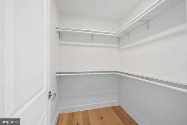 a view of an empty walk in closet
