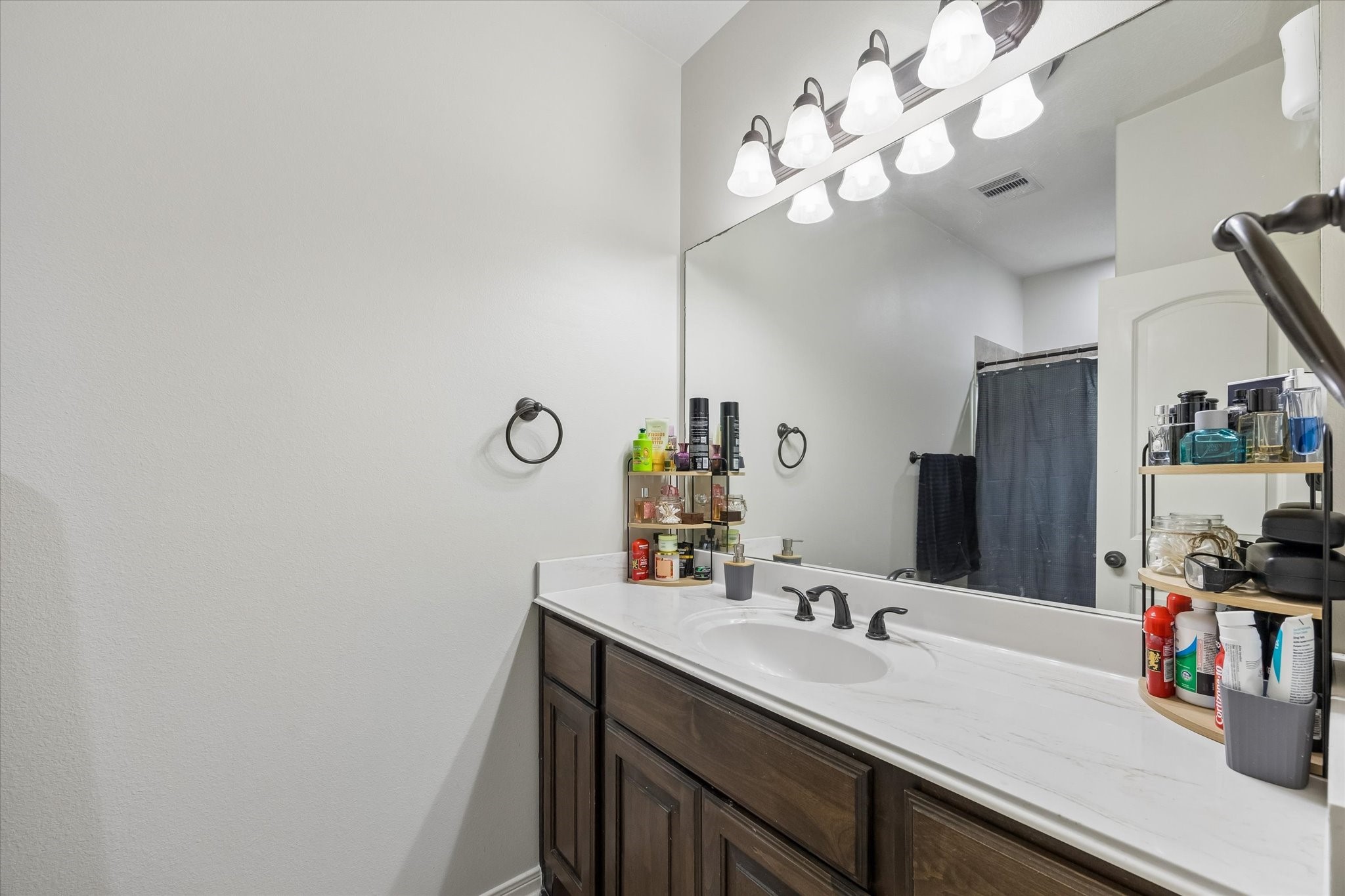 1741 Eagle Lake Road Sealy, TX 77474 - Photo 10 of 15 a bathroom with a sink vanity and a mirror