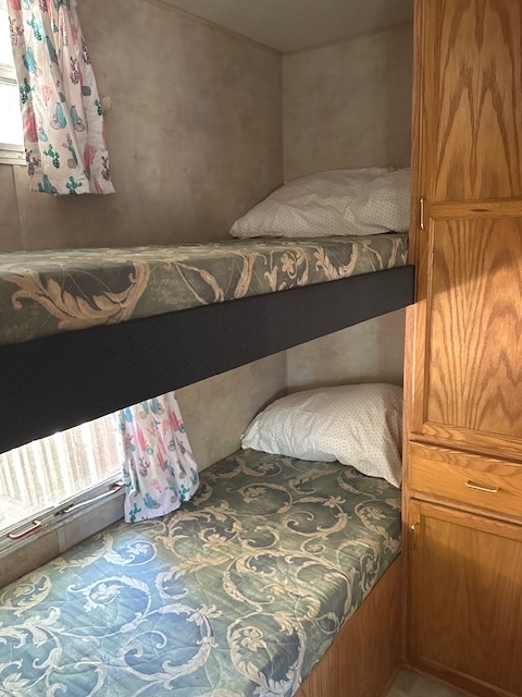 25-37 Woodhaven Sublette, IL 61367 - Photo 3 of 13 a bedroom with a bed and window