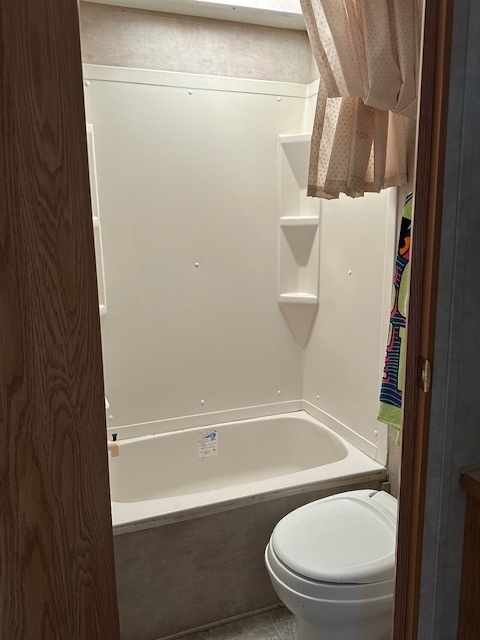 25-37 Woodhaven Sublette, IL 61367 - Photo 7 of 13 a white toilet sitting next to a tub