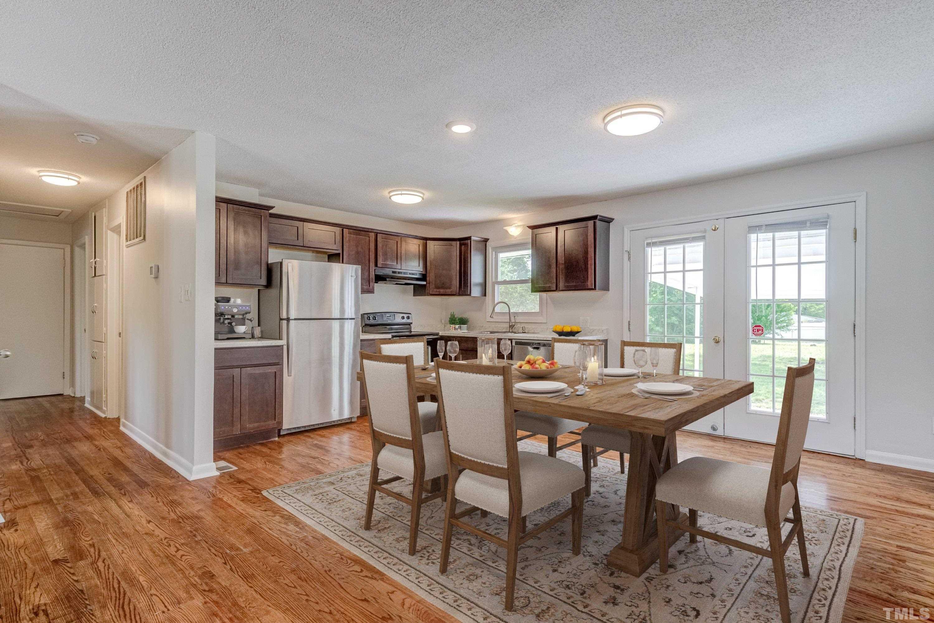 3840 Marsh Creek Road Raleigh, NC 27604 - Photo 16 of 41 a view of a dining room with furniture