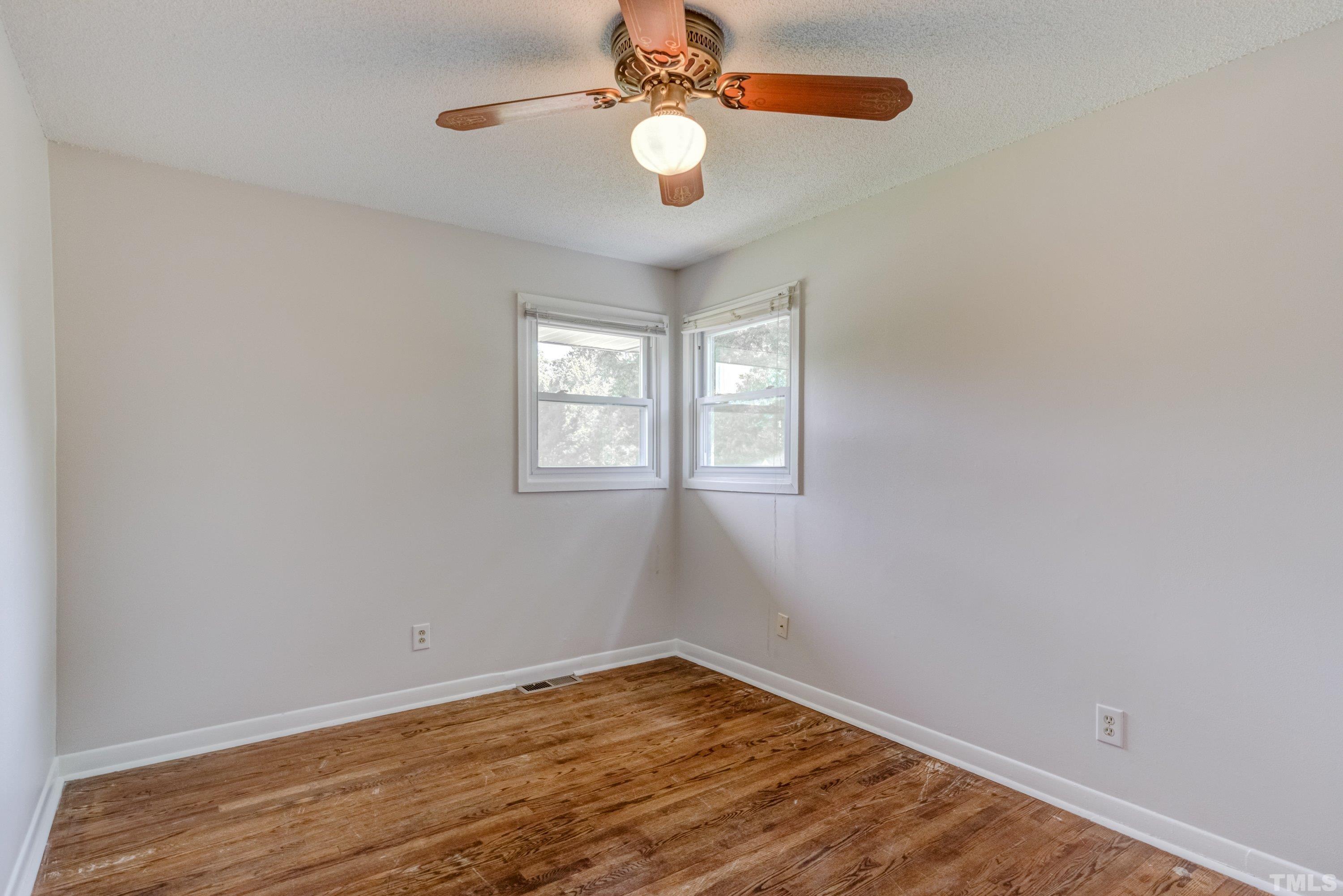 3840 Marsh Creek Road Raleigh, NC 27604 - Photo 26 of 41 an empty room with windows and fan