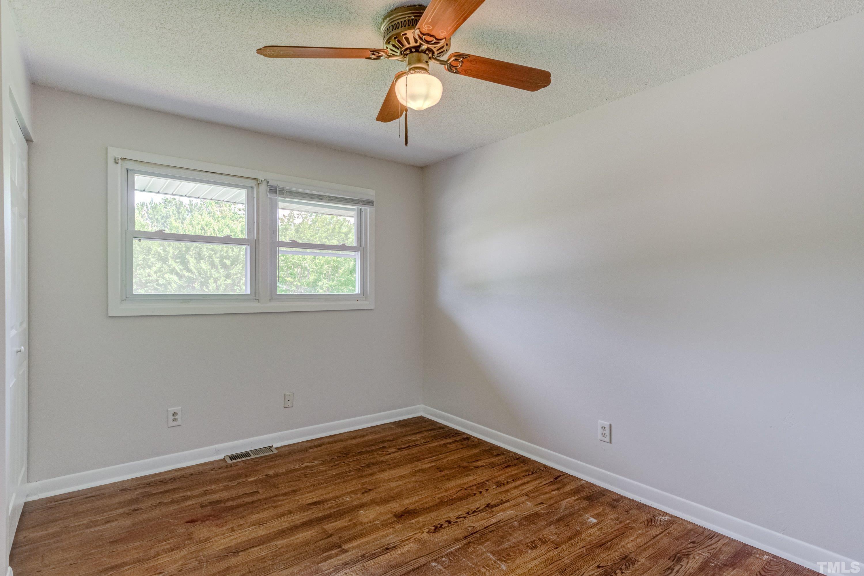 3840 Marsh Creek Road Raleigh, NC 27604 - Photo 29 of 41 wooden floor in an empty room with a window