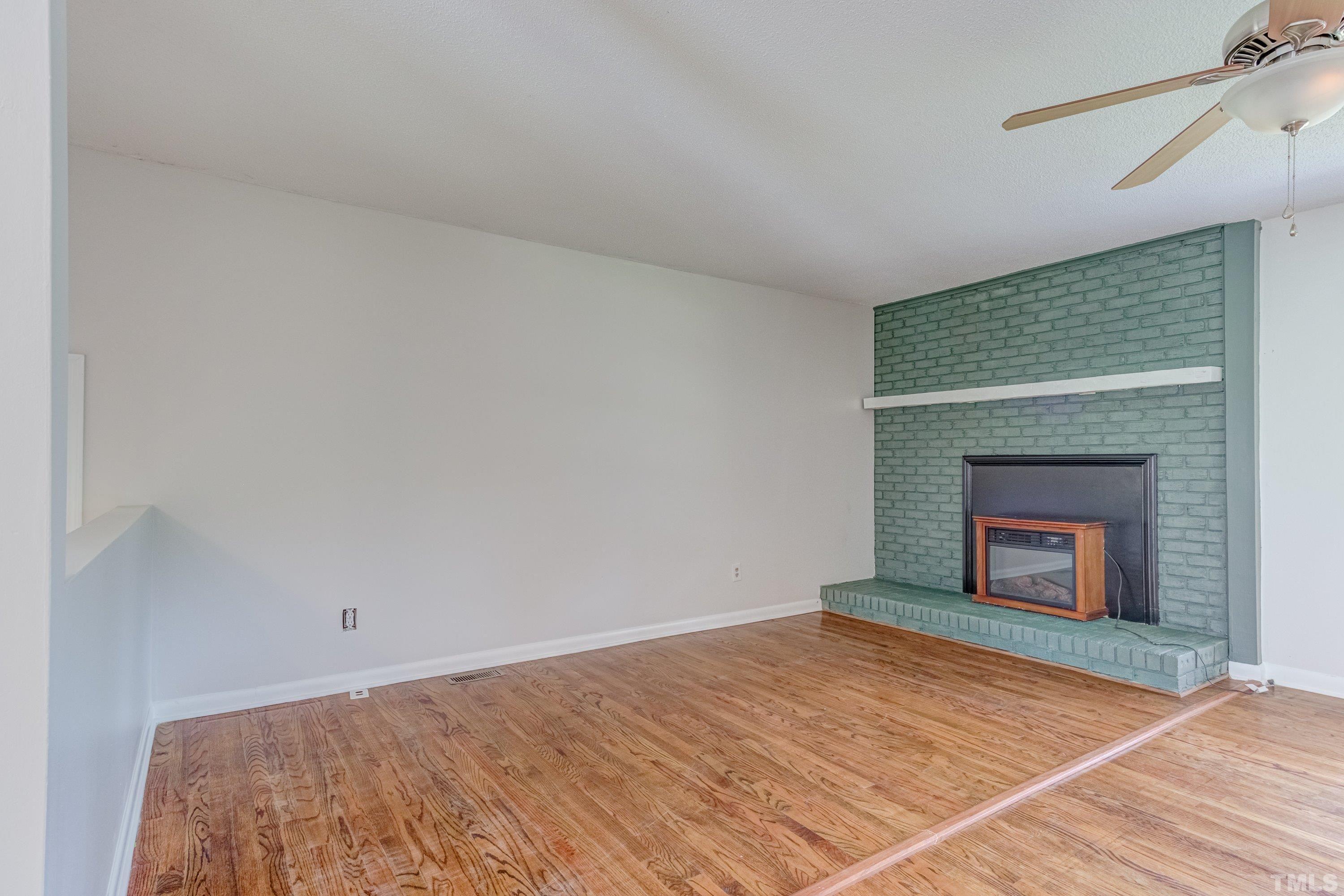 3840 Marsh Creek Road Raleigh, NC 27604 - Photo 6 of 41 a view of empty room with wooden floor