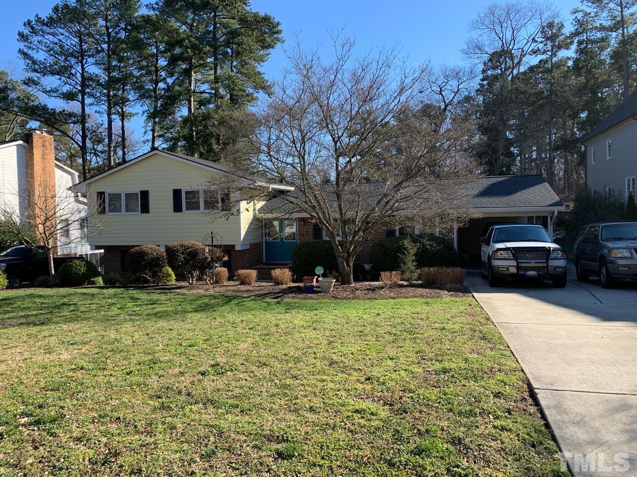 3321 Harden Road Raleigh, NC 27607 - Photo 1 of 26 a front view of a house with a garden