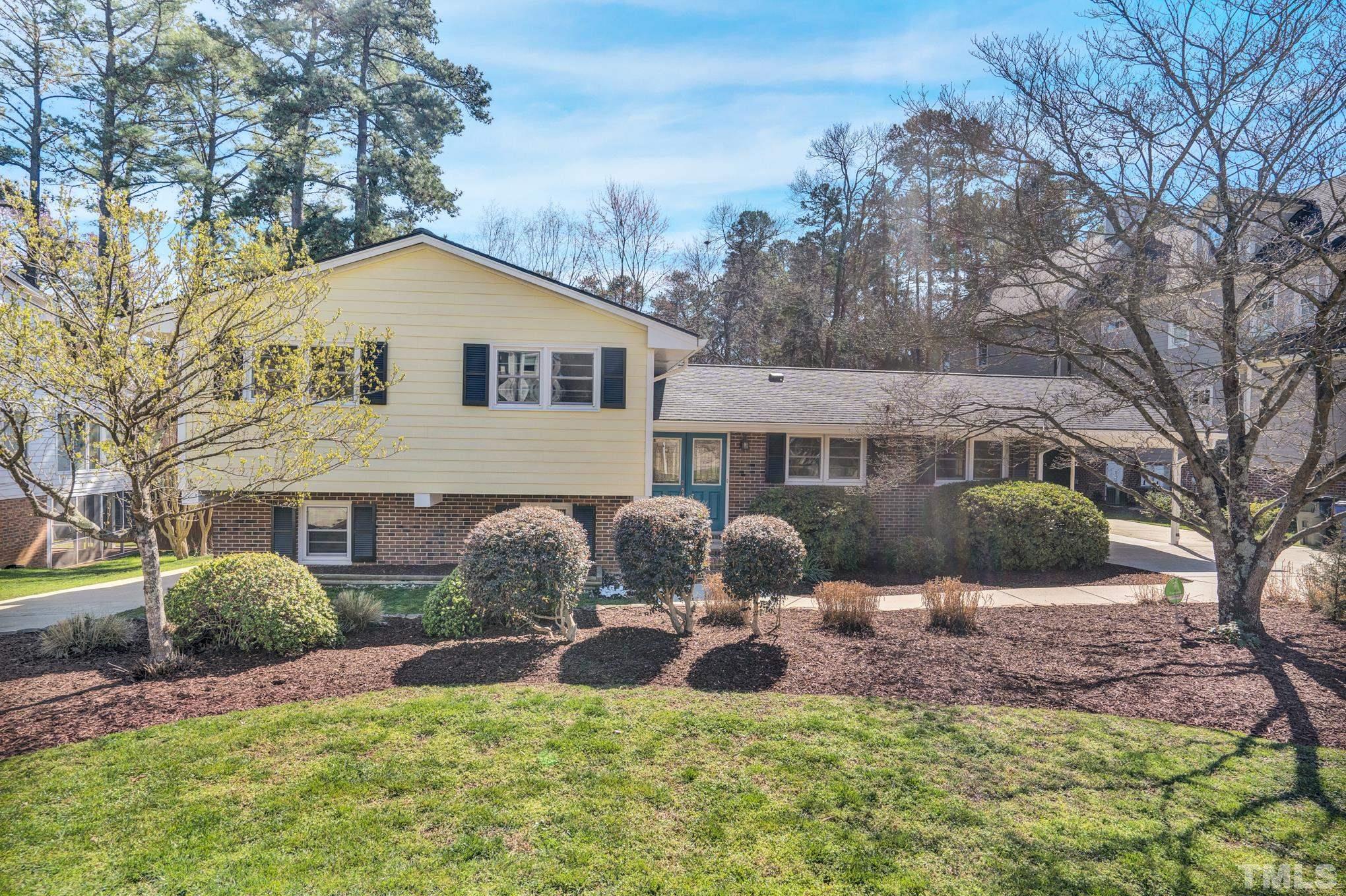3321 Harden Road Raleigh, NC 27607 - Photo 11 of 26 a front view of a house with garden