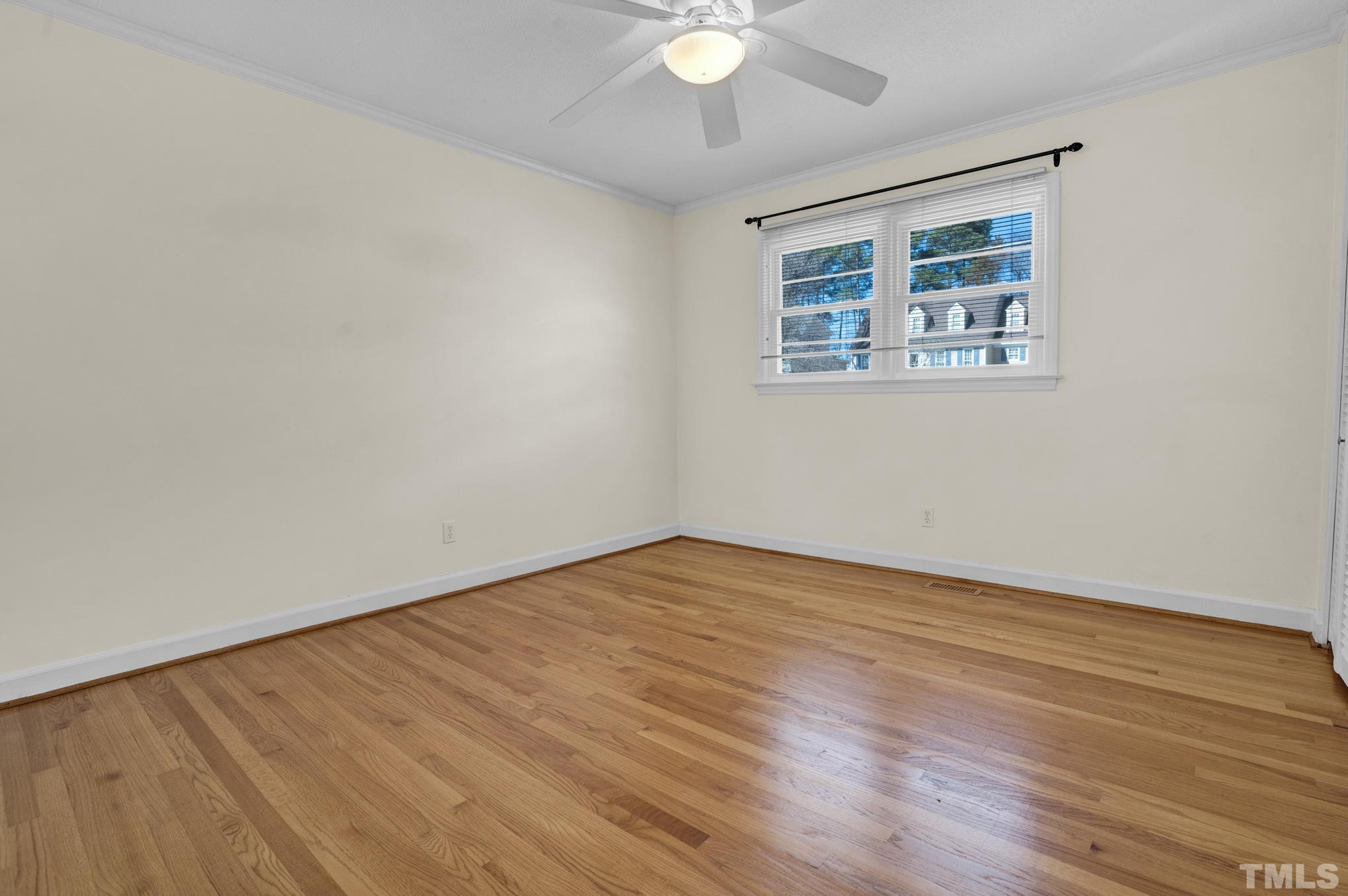 3321 Harden Road Raleigh, NC 27607 - Photo 17 of 26 a view of an empty room with wooden floor and a window