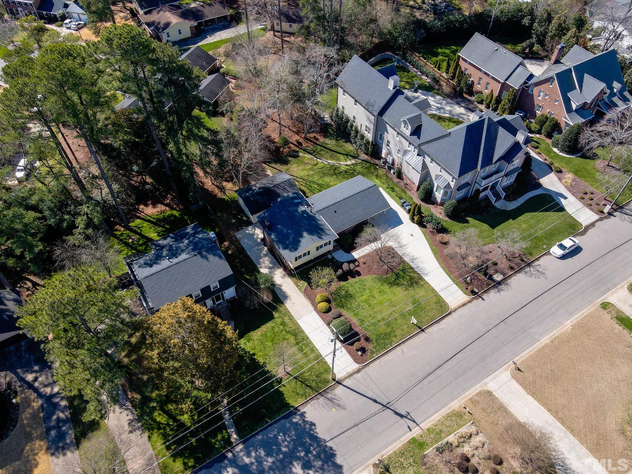 3321 Harden Road Raleigh, NC 27607 - Photo 24 of 26 an aerial view of a house with a garden and trees