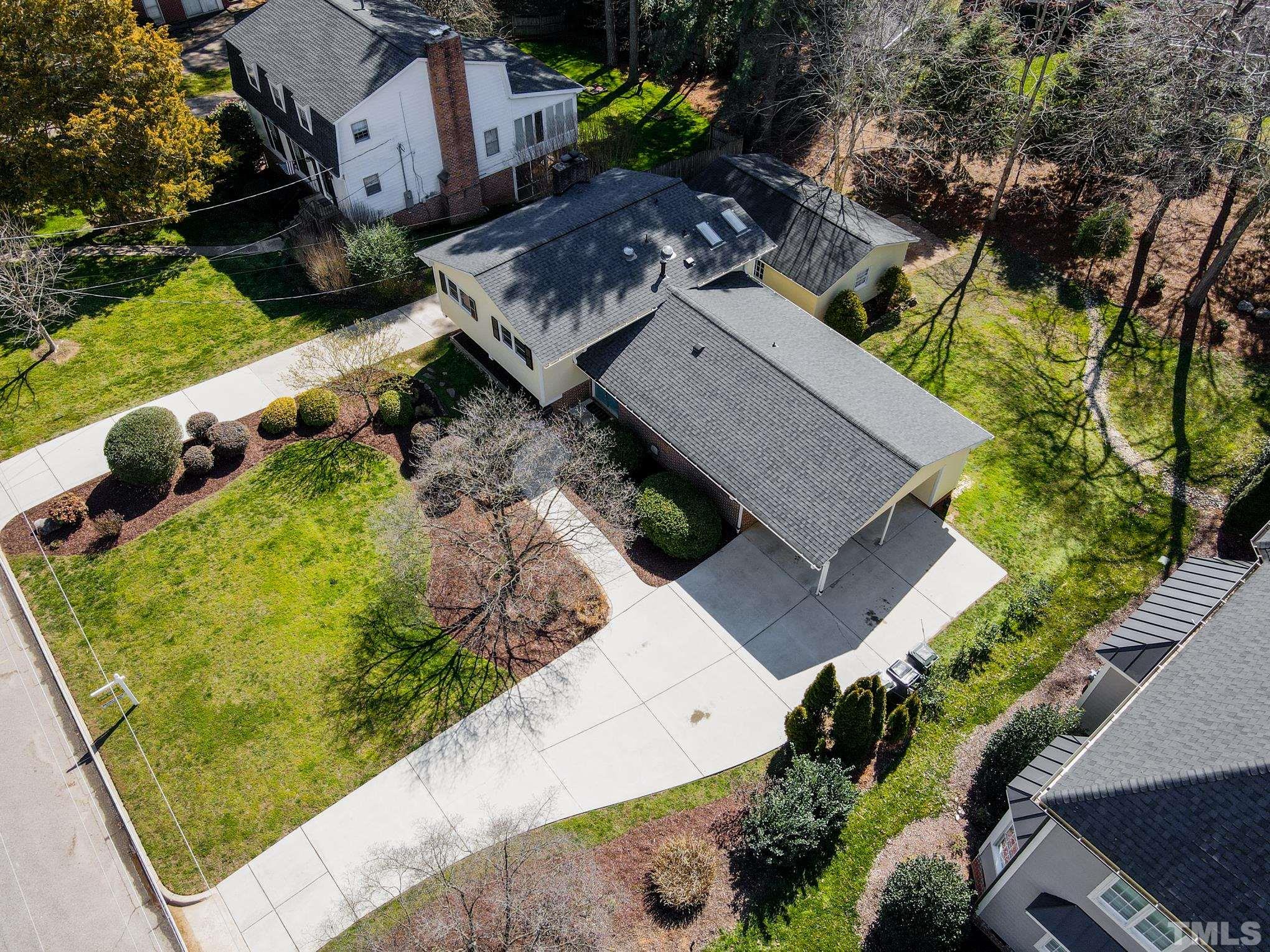 3321 Harden Road Raleigh, NC 27607 - Photo 26 of 26 an aerial view of a house with a yard and potted plants