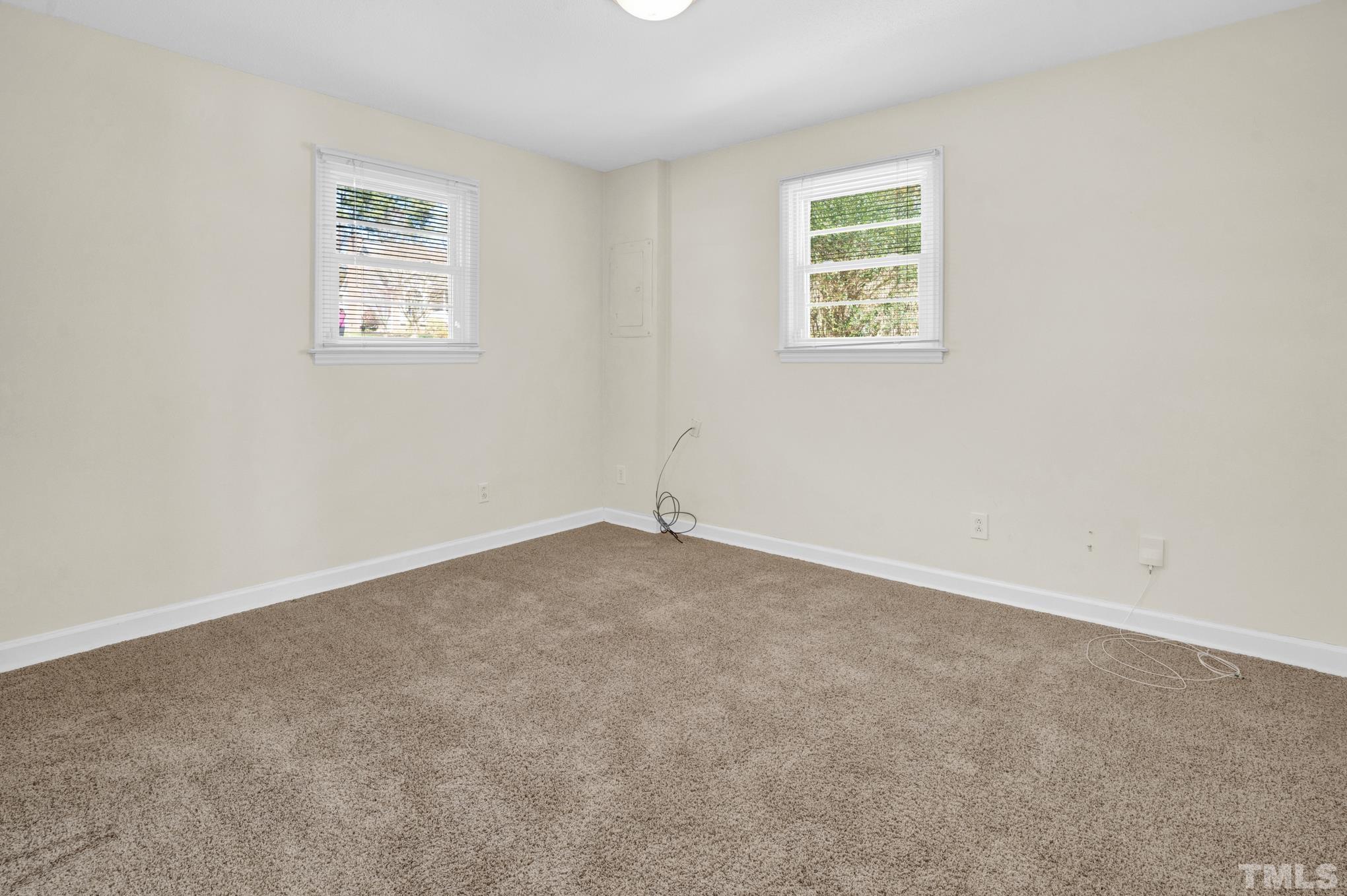 3321 Harden Road Raleigh, NC 27607 - Photo 6 of 26 an empty room with a window