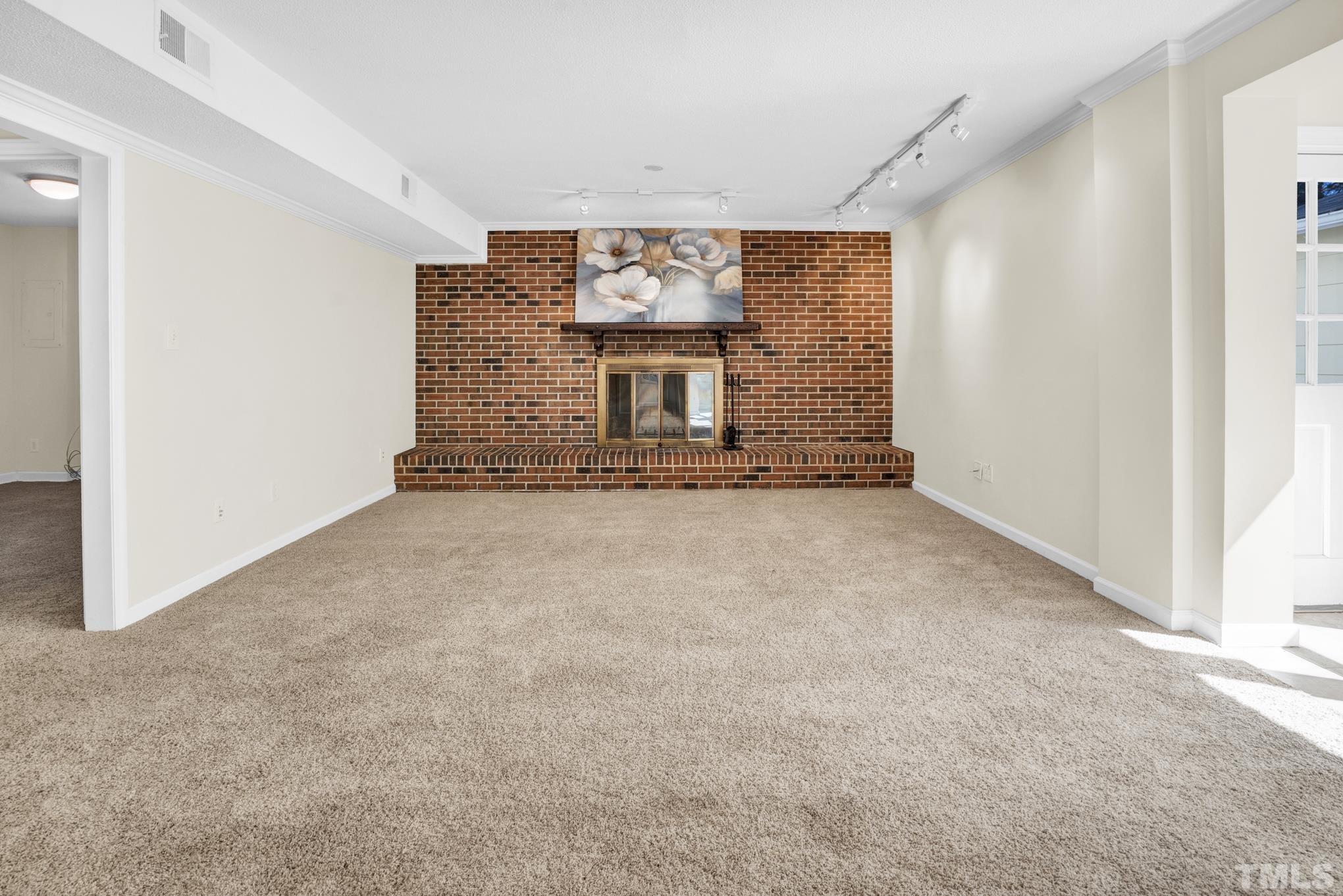 3321 Harden Road Raleigh, NC 27607 - Photo 7 of 26 a view of a hallway with a fireplace