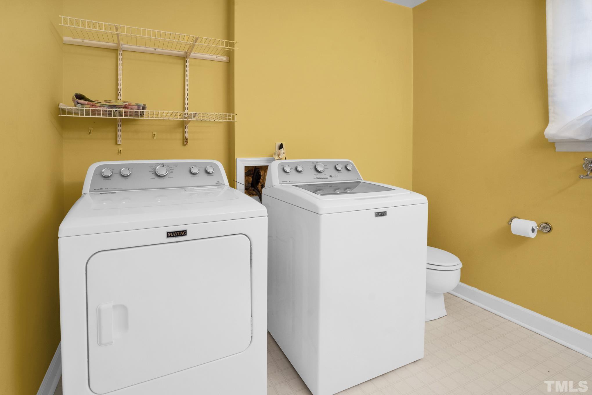 3321 Harden Road Raleigh, NC 27607 - Photo 9 of 26 a utility room with dryer and washer