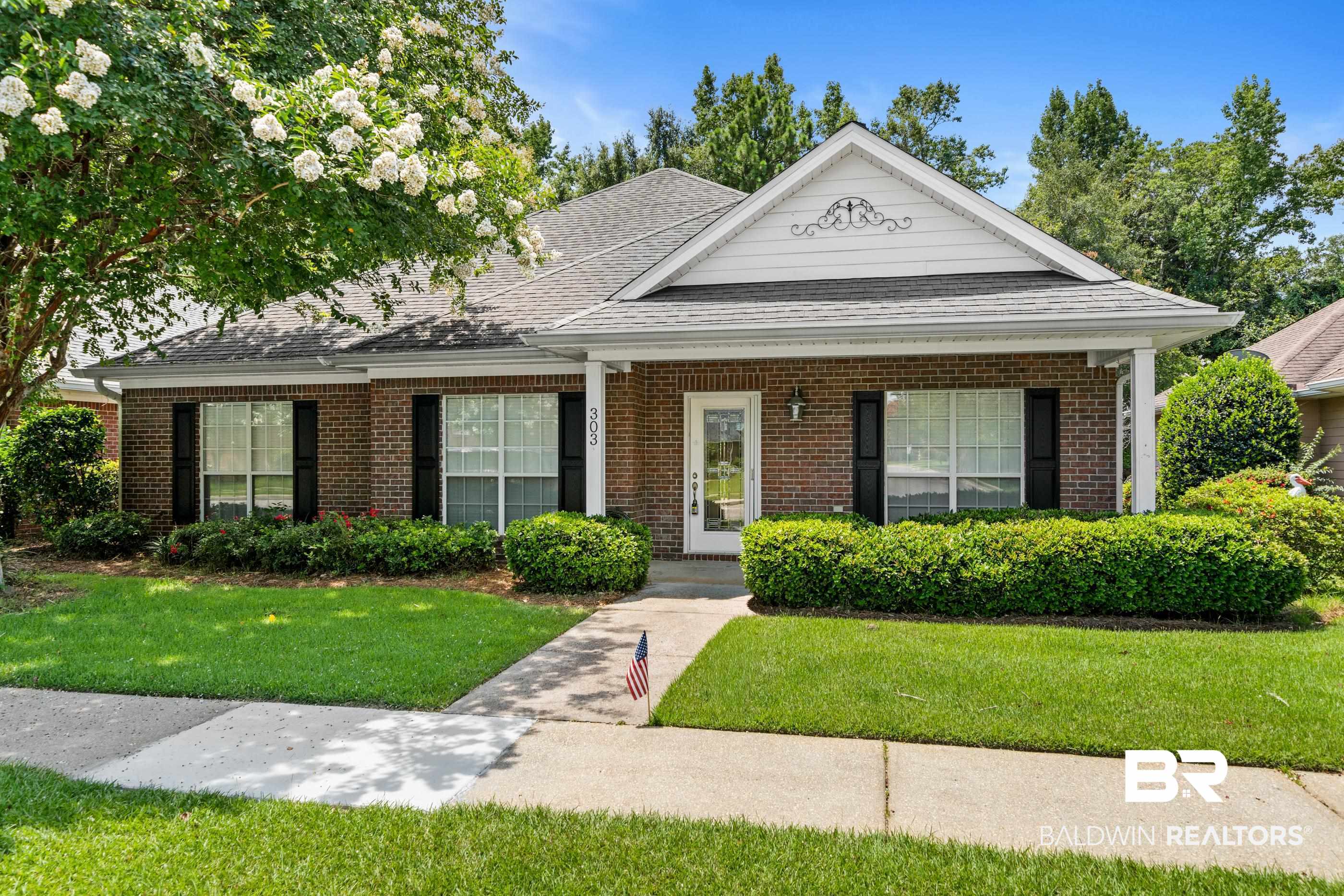 303 Savannah Circle Foley, AL 36535 - Photo 32 of 34 Brick facade home featuring a gabled roofline with decorative trim