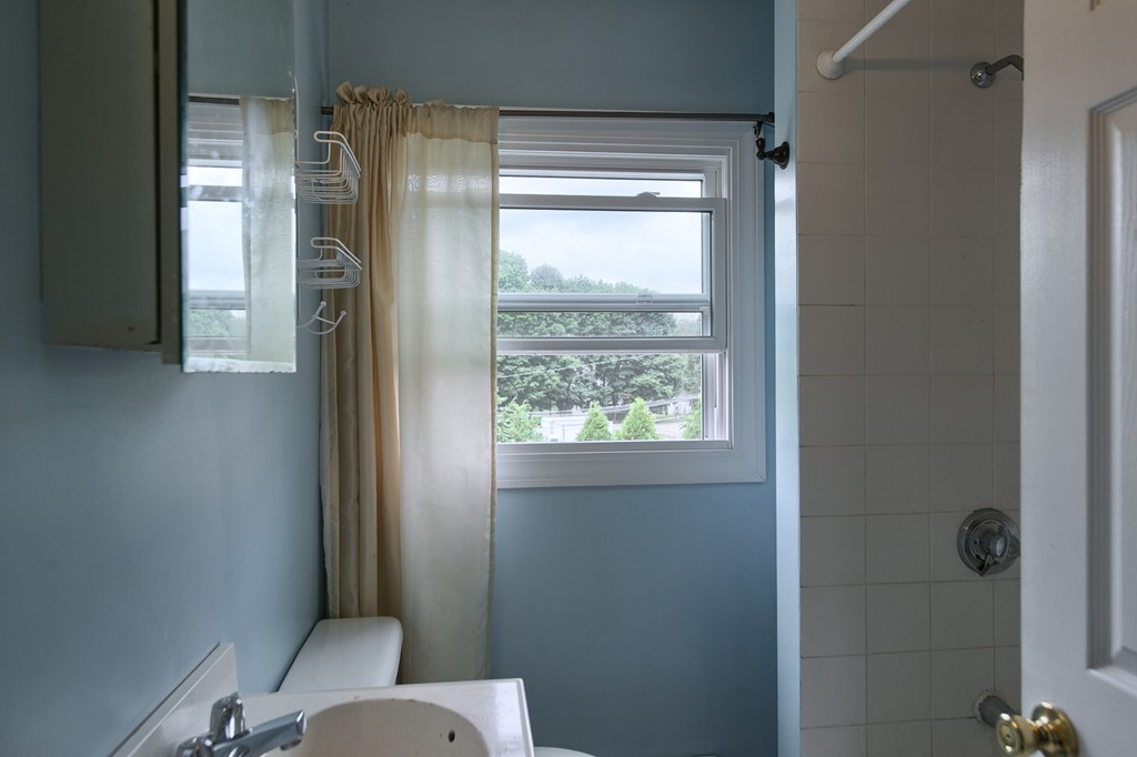 27 Andover Road, Unit 2 Billerica, MA 01821 - Photo 20 of 23 a bathroom with a toilet and a shower