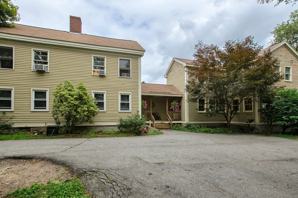 27 Andover Road, Unit 2 Billerica, MA 01821 - Photo 3 of 23 a front view of a house with garden